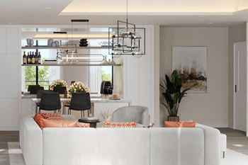 A modern living room with a white sofa and a bar area at Roxy Apartments, Ontario, L8H 0B7